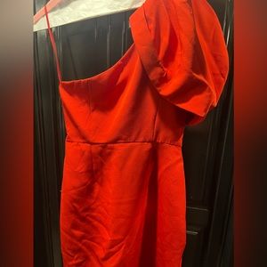 Red romper. Never worn size S